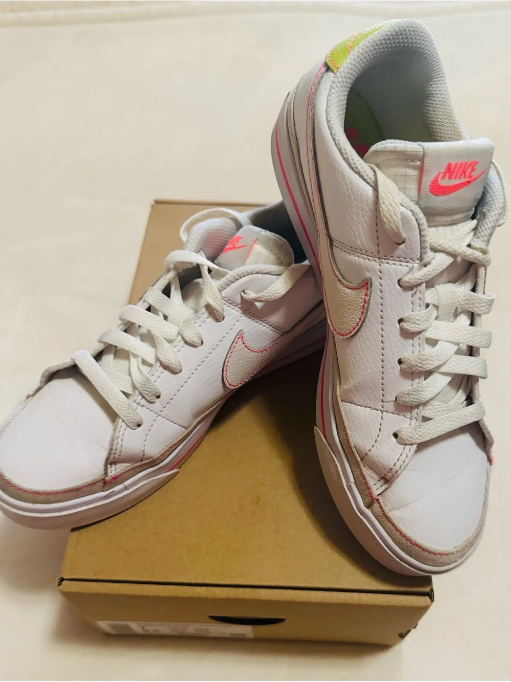 Nike Women's White Sneakers with Pink Accents